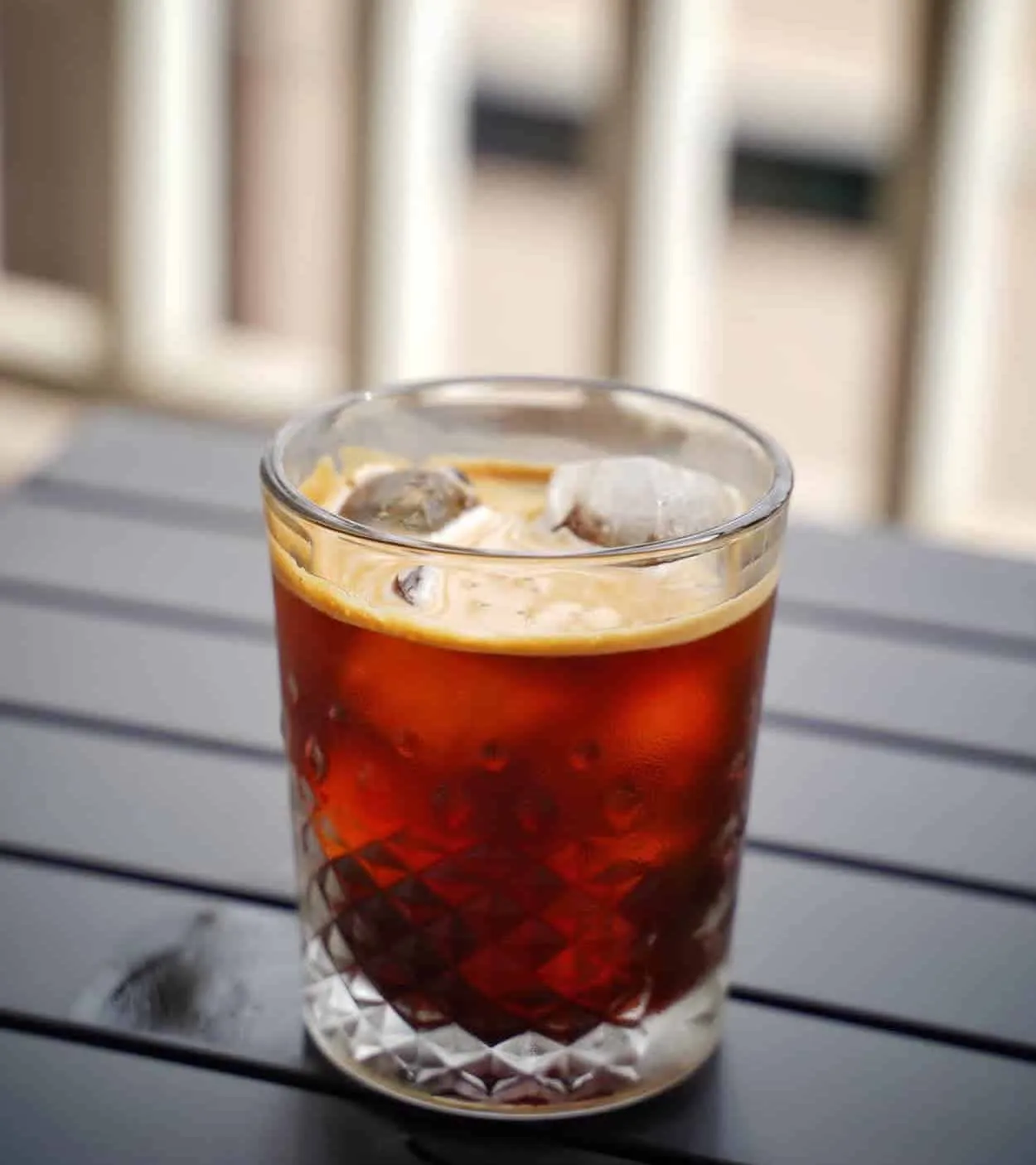 iced americano  on a wooden table