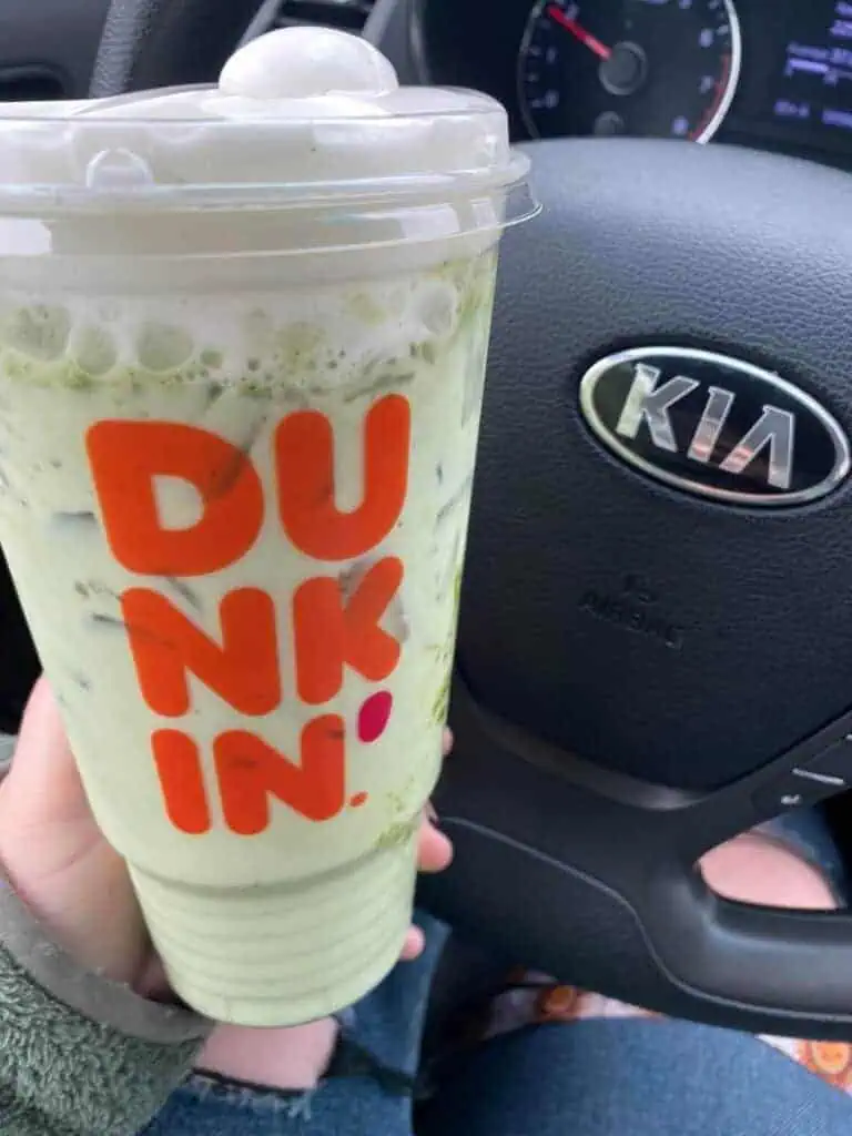 Matcha latte with blueberry and cold foam on top