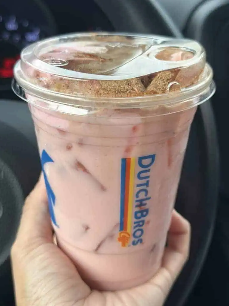Strawberry horchata chai with strawberry soft top and cinammon sprinkle