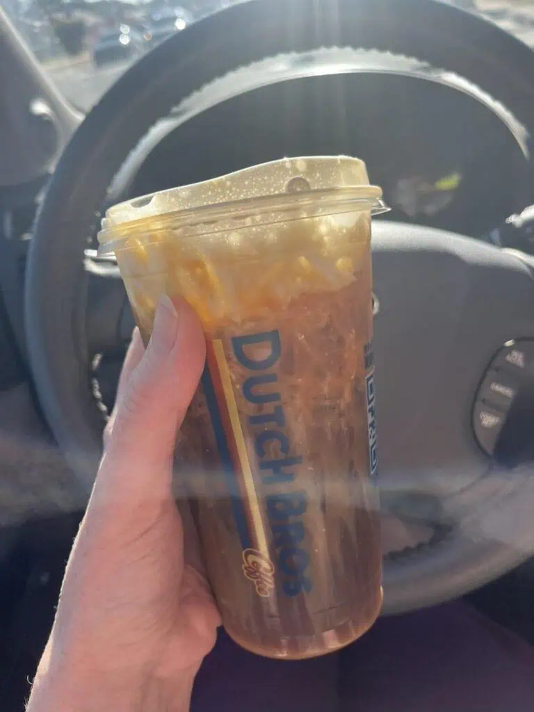 Salted caramel cold brew, soft top, caramel sauce on cup and on top