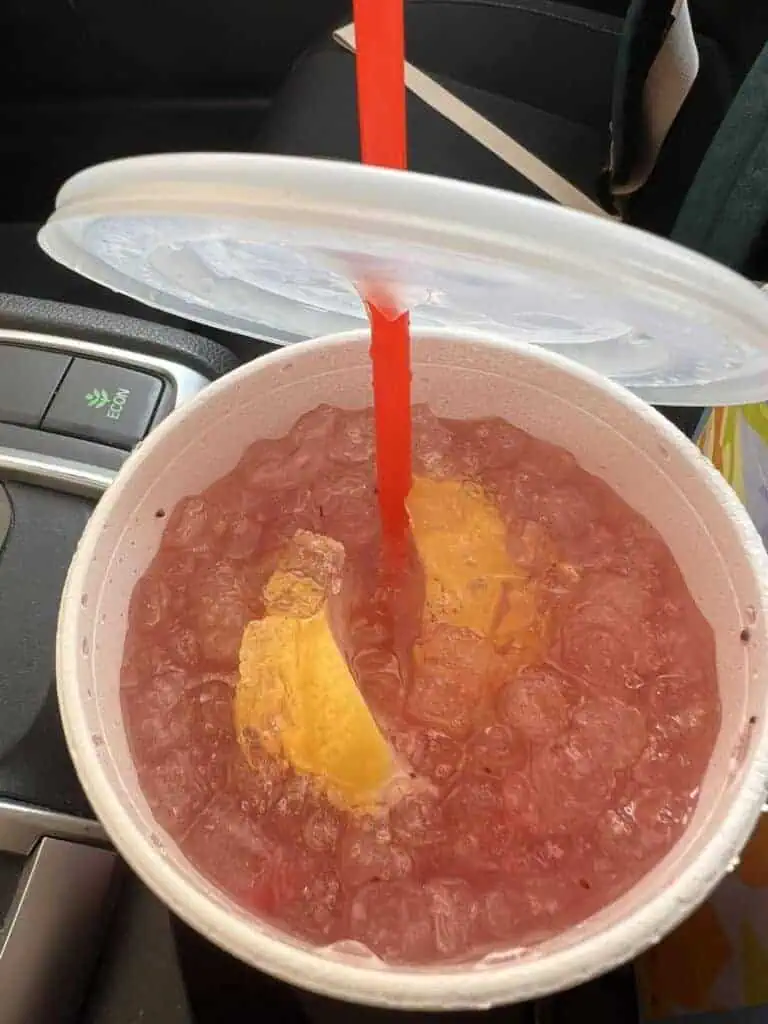 Large water with extra SF peach syrup, lemon, and strawberries