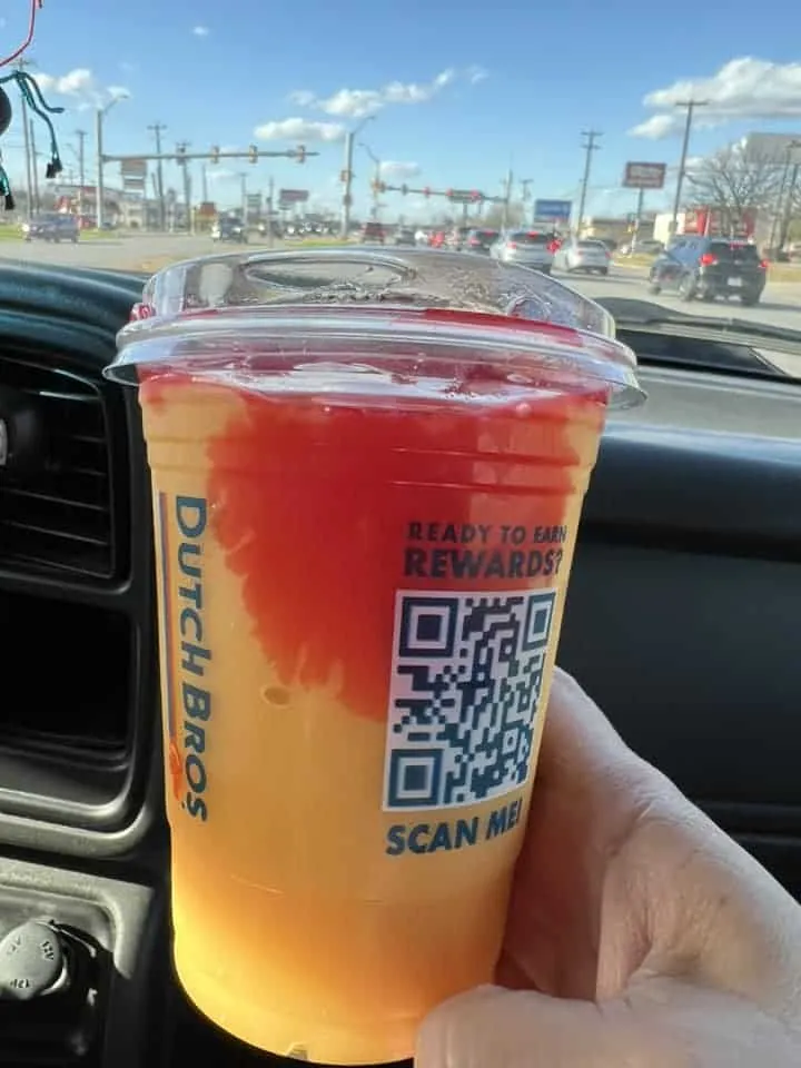 Mango peach smoothie with pomegranate drizzle double blended