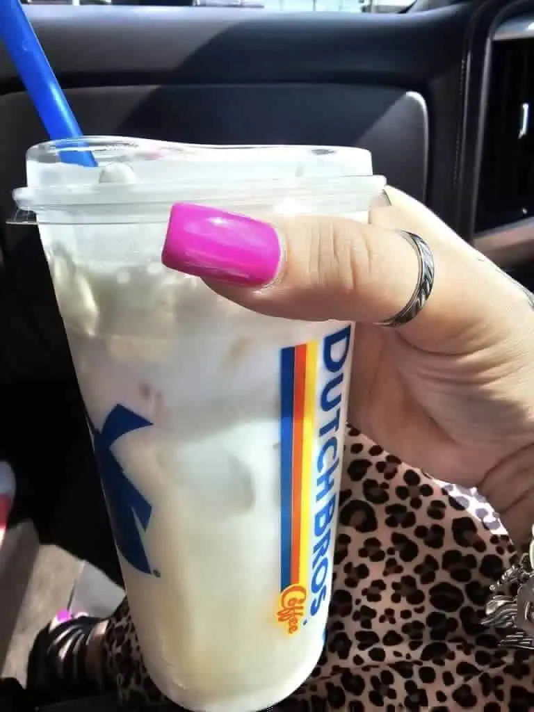 Pineapple coconut green tea, add coconut milk, with coconut soft top & fresh strawberries