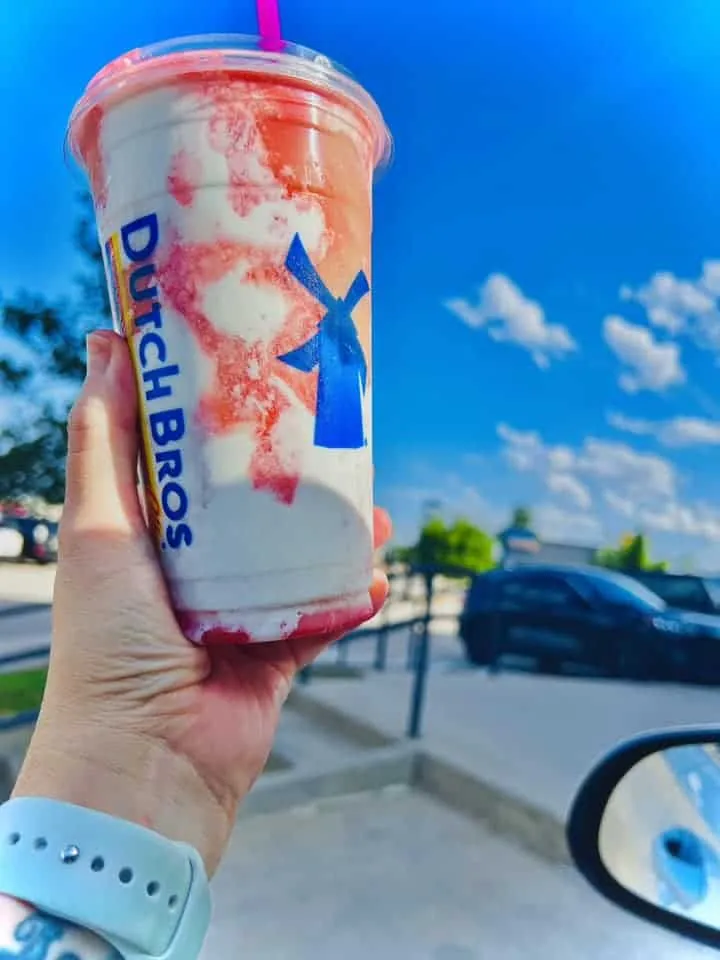 double blended strawberry smoothie parfait with soft top and strawberry drizzle