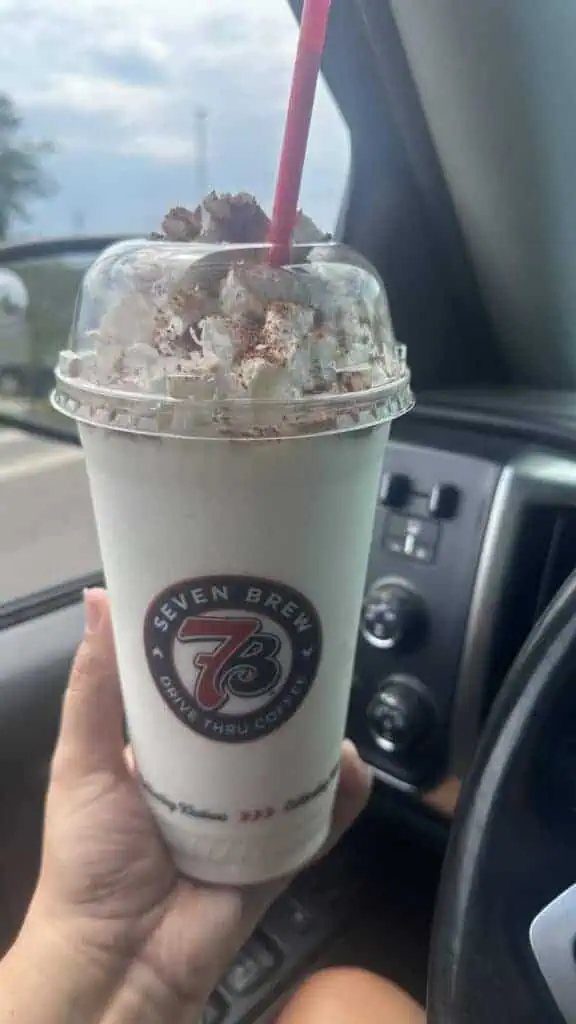Shake with cupcake, whipped cream and chocolate sprinkles 